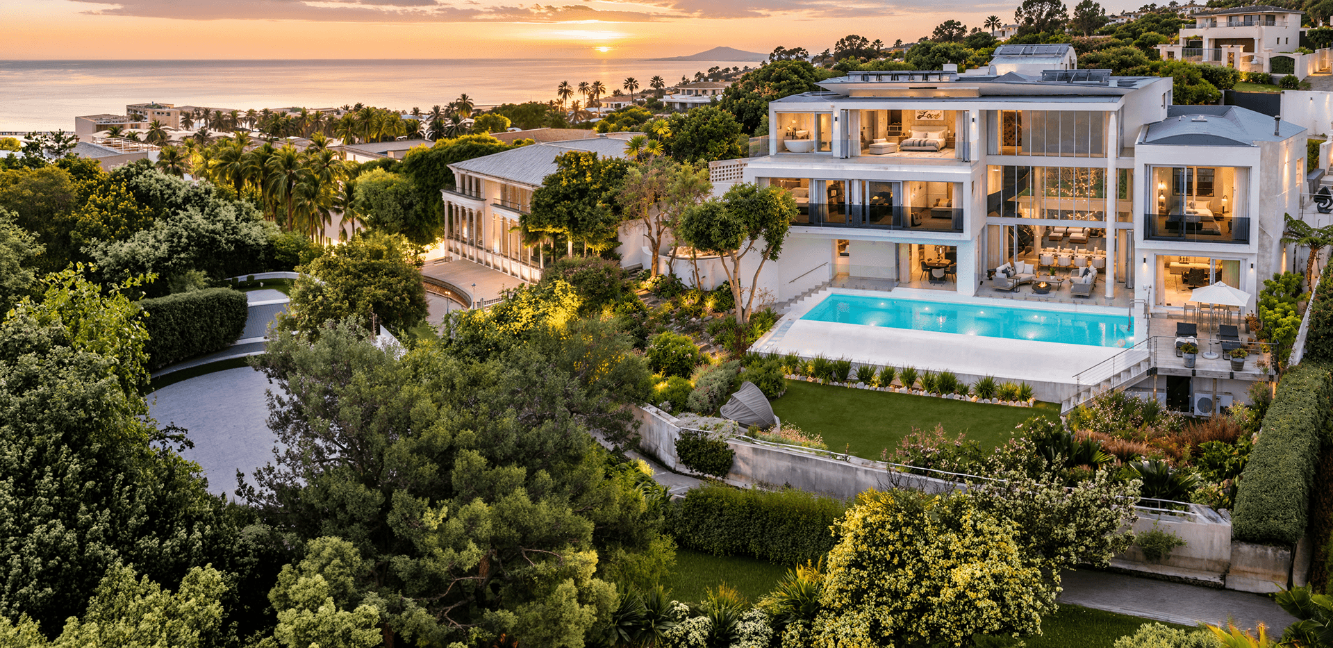 Aerial view of Cutty Sark Villa and its infinity pool above Plettenberg Bay at sunset